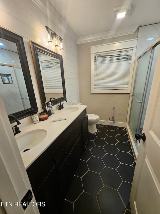 828 Noragate Rd, Knoxville, TN 37919 - full bathroom with a shower with door, toilet, ornamental molding, double vanity, and wood walls
