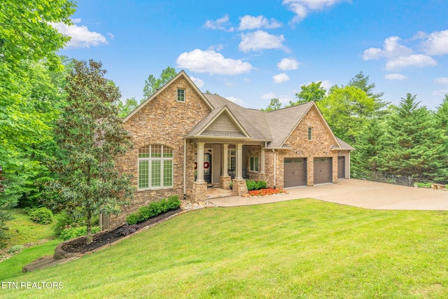 111 Winchester Cir, Oak Ridge, TN 37830 - craftsman house featuring stone siding, a front yard, a garage, and driveway