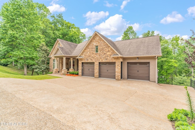 111 Winchester Cir, Oak Ridge, TN 37830 - view of front of home with roof with shingles, concrete driveway, a porch, and an attached garage