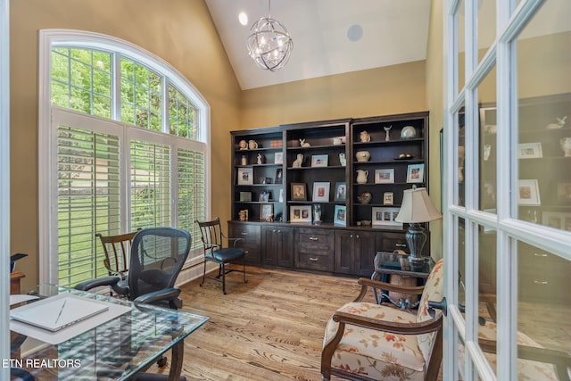 111 Winchester Cir, Oak Ridge, TN 37830 - home office with high vaulted ceiling, light wood-style floors, and a chandelier