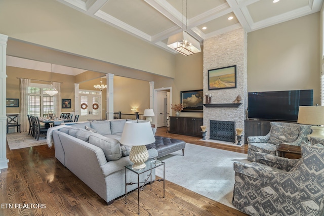 111 Winchester Cir, Oak Ridge, TN 37830 - living room with a chandelier, ornate columns, coffered ceiling, beam ceiling, and wood finished floors