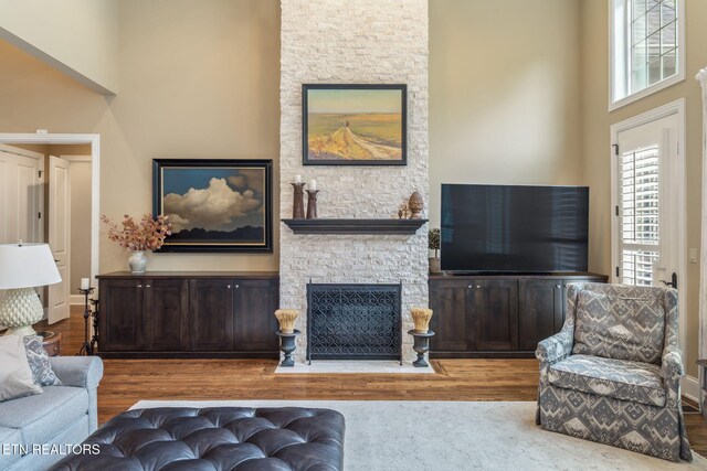 111 Winchester Cir, Oak Ridge, TN 37830 - living area with a stone fireplace and wood finished floors