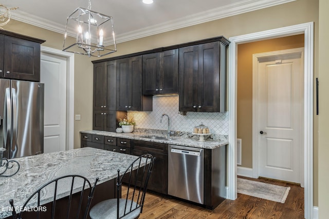 111 Winchester Cir, Oak Ridge, TN 37830 - kitchen featuring appliances with stainless steel finishes, a sink, a chandelier, dark wood-type flooring, and crown molding