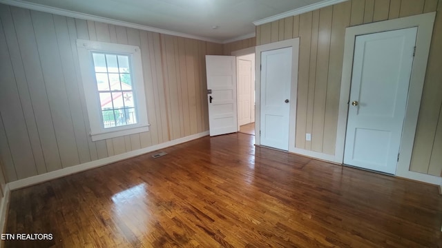 806 Vale St, Loudon, TN 37774 - unfurnished bedroom with crown molding, wood finished floors, and baseboards