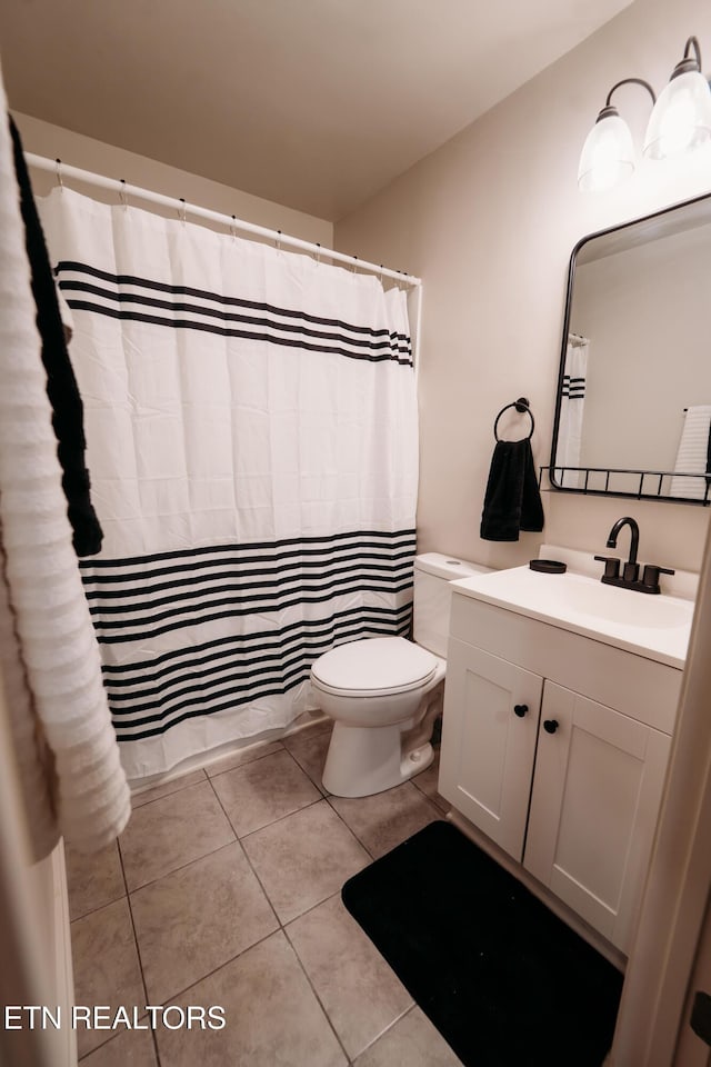 1799 Baker Hwy, Huntsville, TN 37756 - full bath with vanity, toilet, tile patterned floors, and a shower with shower curtain