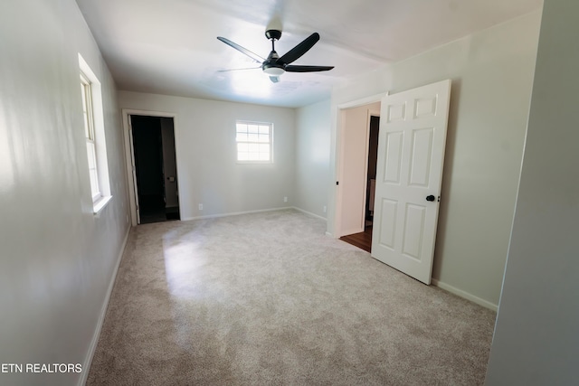 1799 Baker Hwy, Huntsville, TN 37756 - unfurnished bedroom with carpet floors, baseboards, and ceiling fan