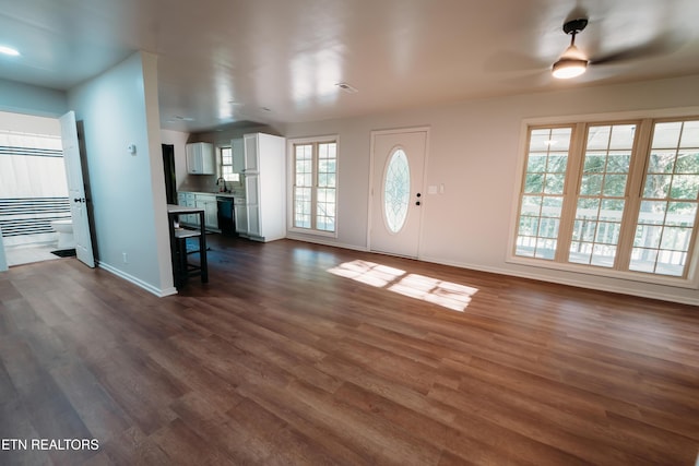 1799 Baker Hwy, Huntsville, TN 37756 - unfurnished living room with a ceiling fan, baseboards, and dark wood-style floors