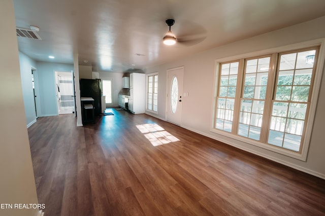 1799 Baker Hwy, Huntsville, TN 37756 - unfurnished living room with dark wood-type flooring, baseboards, and a ceiling fan