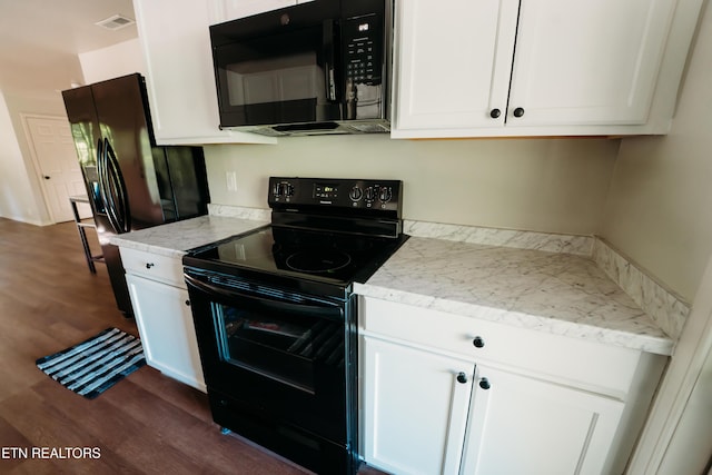1799 Baker Hwy, Huntsville, TN 37756 - kitchen with black appliances, dark wood-style floors, white cabinets, and light stone countertops
