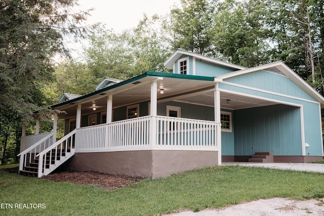 1799 Baker Hwy, Huntsville, TN 37756 - view of front of house featuring covered porch, a front lawn, stairs, and metal roof