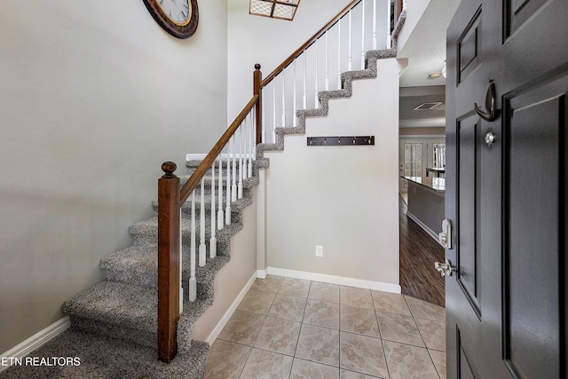 1316 Mountain Meadows Way, Sevierville, TN 37862 - stairway featuring baseboards and tile patterned floors