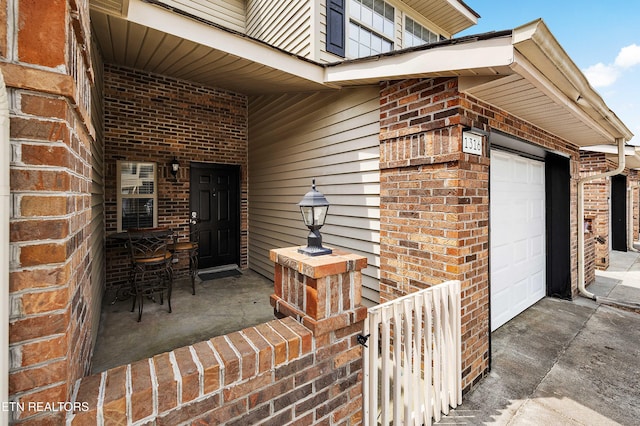 1316 Mountain Meadows Way, Sevierville, TN 37862 - view of exterior entry featuring brick siding and driveway