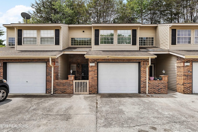 1316 Mountain Meadows Way, Sevierville, TN 37862 - view of property with brick siding, driveway, a garage, and a shingled roof