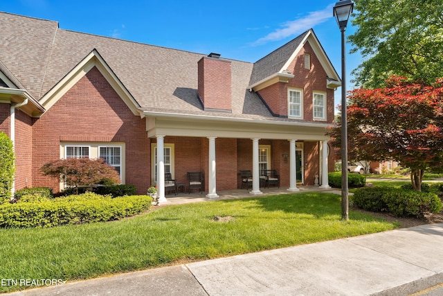 12311 Willow Ridge Ln, Farragut, TN 37934 - view of front of house featuring brick siding, a front yard, and covered porch
