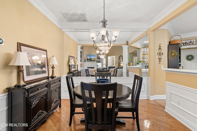 12311 Willow Ridge Ln, Farragut, TN 37934 - dining space with decorative columns, a chandelier, light wood-style floors, and crown molding