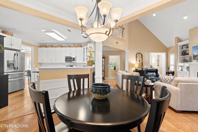 12311 Willow Ridge Ln, Farragut, TN 37934 - dining space featuring a chandelier, light wood-type flooring, crown molding, recessed lighting, and ornate columns