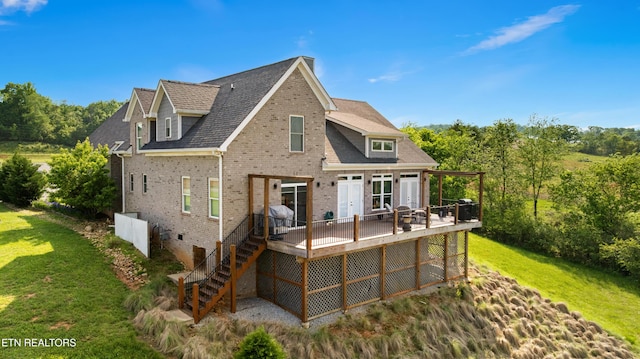 338 Cape Lookout Lgt, Loudon, TN 37774 - rear view of property with brick siding, a deck, a lawn, and stairs