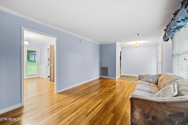 7613 Luscombe Dr, Knoxville, TN 37919 - living area featuring light wood-type flooring, crown molding, healthy amount of natural light, and baseboards