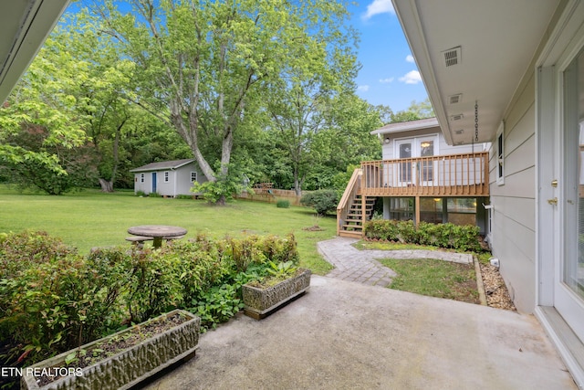 7613 Luscombe Dr, Knoxville, TN 37919 - view of grassy yard with a patio area, stairs, a deck, and view of scattered trees