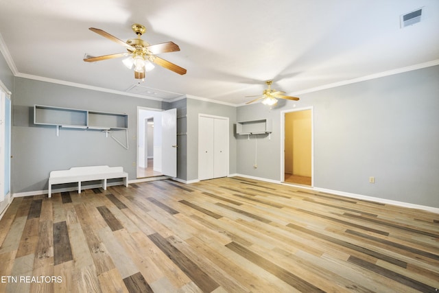 7613 Luscombe Dr, Knoxville, TN 37919 - unfurnished living room with a ceiling fan, attic access, wood finished floors, baseboards, and crown molding