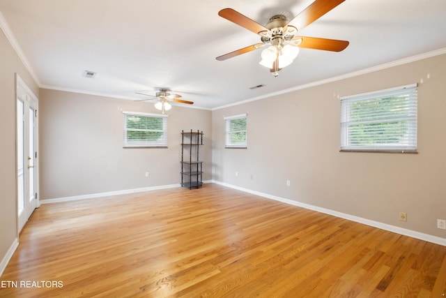 7613 Luscombe Dr, Knoxville, TN 37919 - spare room featuring light wood-style floors, crown molding, ceiling fan, and baseboards