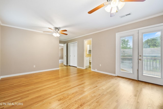 7613 Luscombe Dr, Knoxville, TN 37919 - empty room with a ceiling fan, french doors, light wood finished floors, and ornamental molding