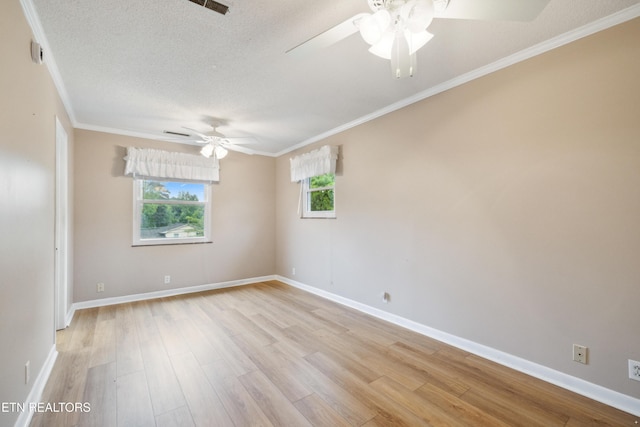 7613 Luscombe Dr, Knoxville, TN 37919 - spare room with a ceiling fan, light wood-style flooring, crown molding, baseboards, and a textured ceiling