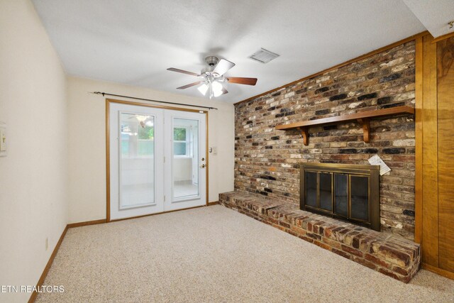 7613 Luscombe Dr, Knoxville, TN 37919 - unfurnished living room with a ceiling fan, carpet flooring, baseboards, and a fireplace