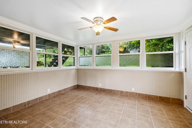 7613 Luscombe Dr, Knoxville, TN 37919 - unfurnished sunroom with baseboards and tile patterned floors