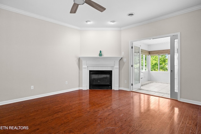 1025 Ree Way Unit 20, Knoxville, TN 37909 - unfurnished living room featuring ornamental molding, wood finished floors, ceiling fan, a tiled fireplace, and baseboards