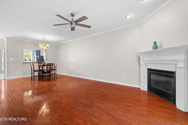 1025 Ree Way Unit 20, Knoxville, TN 37909 - living room with ceiling fan, wood finished floors, crown molding, a chandelier, and baseboards