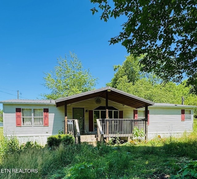 2330 Mynatt Rd, Knoxville, TN 37918 - manufactured / mobile home featuring covered porch and metal roof