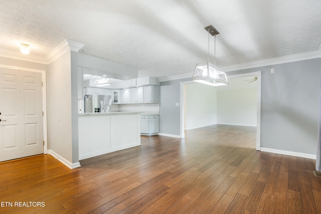 6799 Hickory Creek Rd, Lenoir City, TN 37771 - unfurnished living room with ornamental molding, baseboards, dark wood-style floors, and ceiling fan