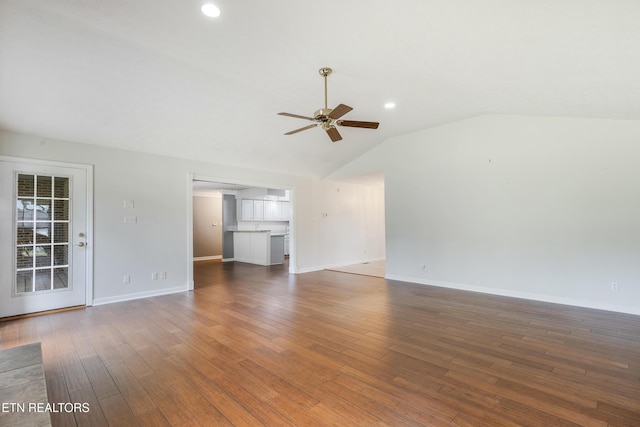 6799 Hickory Creek Rd, Lenoir City, TN 37771 - unfurnished living room with a ceiling fan, vaulted ceiling, wood finished floors, baseboards, and recessed lighting