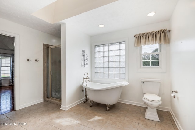 6799 Hickory Creek Rd, Lenoir City, TN 37771 - bathroom featuring a freestanding bath, a stall shower, tile patterned flooring, and baseboards