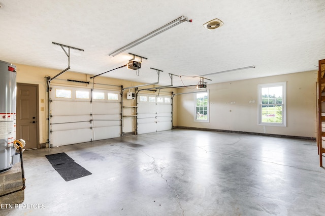 6799 Hickory Creek Rd, Lenoir City, TN 37771 - garage with a garage door opener, gas water heater, and baseboards