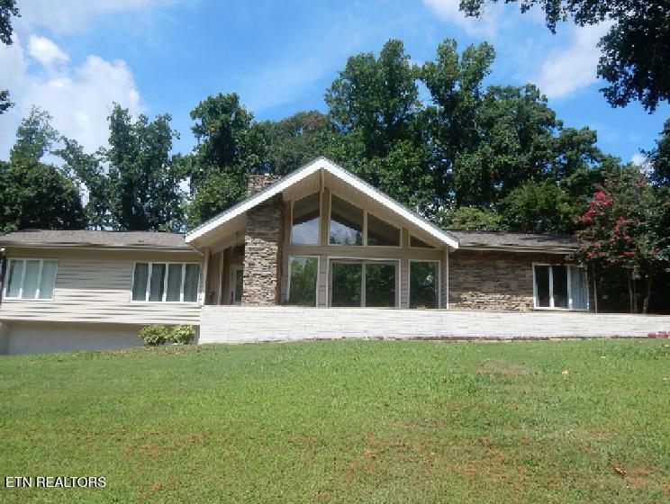 3729 Vista Rd, Louisville, TN 37777 - back of house with stone siding and a yard