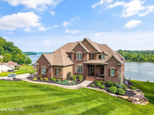 436 Silent River Ln, Loudon, TN 37774 - view of front of home with brick siding, a water view, a front lawn, and covered porch