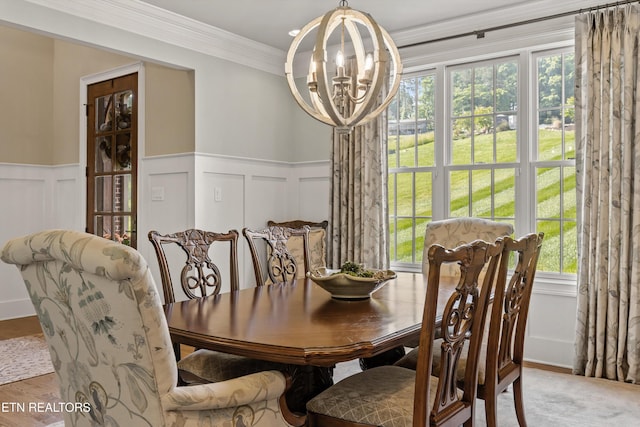 436 Silent River Ln, Loudon, TN 37774 - dining space with a chandelier, a decorative wall, a wainscoted wall, healthy amount of natural light, and ornamental molding