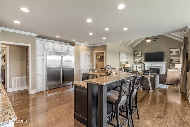 436 Silent River Ln, Loudon, TN 37774 - kitchen featuring built in refrigerator, crown molding, a sink, light stone countertops, and ceiling fan