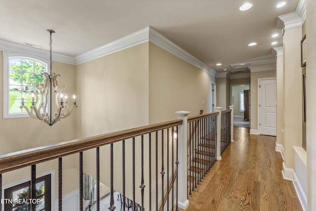 436 Silent River Ln, Loudon, TN 37774 - hallway featuring wood finished floors, a chandelier, recessed lighting, an upstairs landing, and crown molding