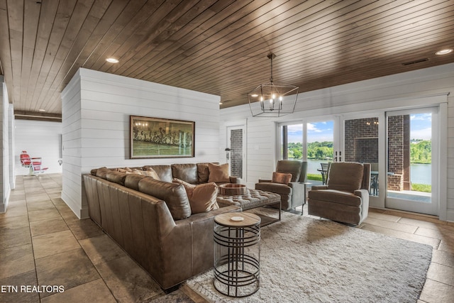 436 Silent River Ln, Loudon, TN 37774 - living area featuring wooden ceiling, a chandelier, recessed lighting, stone tile flooring, and wooden walls