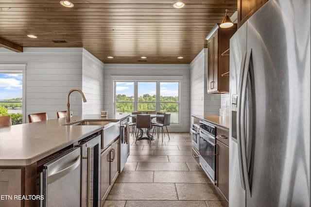 436 Silent River Ln, Loudon, TN 37774 - kitchen with appliances with stainless steel finishes, healthy amount of natural light, stone tile floors, beverage cooler, and recessed lighting