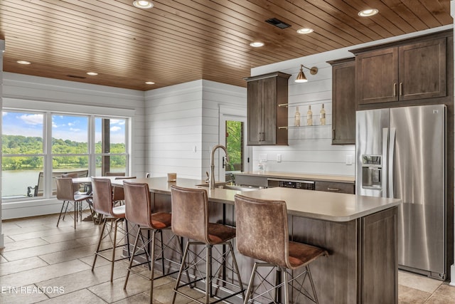 436 Silent River Ln, Loudon, TN 37774 - kitchen with stainless steel fridge, a sink, recessed lighting, a kitchen island with sink, and wood ceiling