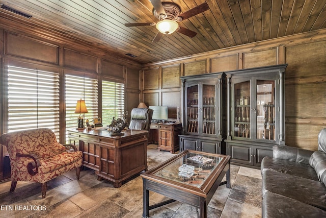 436 Silent River Ln, Loudon, TN 37774 - home office with a ceiling fan, wood ceiling, stone tile flooring, and a decorative wall