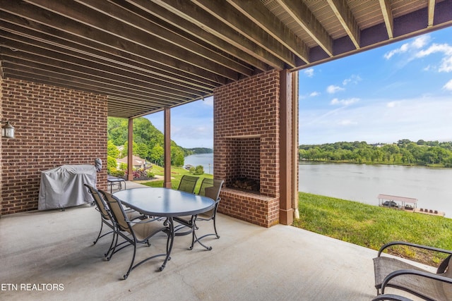 436 Silent River Ln, Loudon, TN 37774 - view of patio / terrace featuring a water view, outdoor dining area, and an outdoor brick fireplace