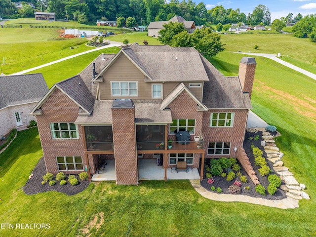 436 Silent River Ln, Loudon, TN 37774 - back of property featuring a patio area, a sunroom, brick siding, and a chimney