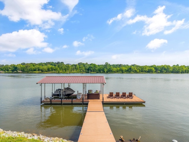 436 Silent River Ln, Loudon, TN 37774 - dock area with boat lift, a water view, and a forest view