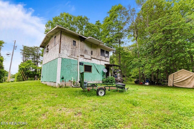 157 Chestnut Cir, Lafollette, TN 37766 - back of property featuring a lawn and stucco siding