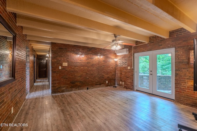 944 Smoky Mountain View Ct, Seymour, TN 37865 - unfurnished room featuring wood finished floors, beamed ceiling, french doors, brick wall, and ceiling fan